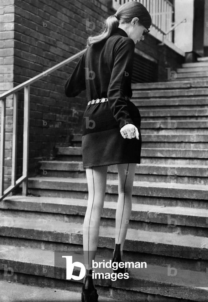 Clothing - Stockings Seamed stockings feature. Model walks up steps. November 1968 P018433