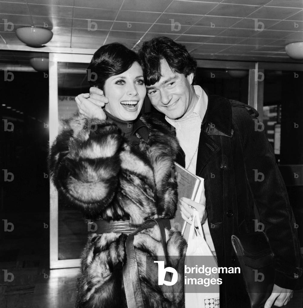 Hairdresser Vidal Sassoon and his wife Beverley at Heathrow Airport today, February 1975 (b/w photo)