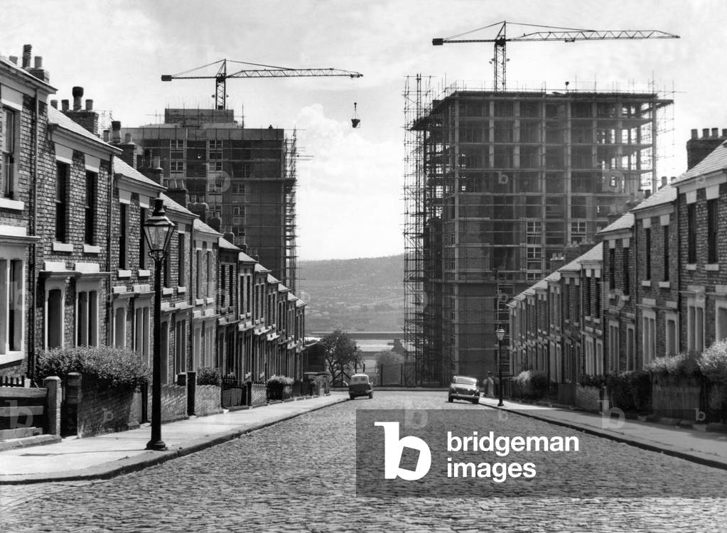 The past, present and the future, there is a new feature on the ever-changing skyline of Newcastle provided by the construction of these twin 12-storey high rise flats at Cruddas Park Housing Estate 23 July 1960 (b/w photo)