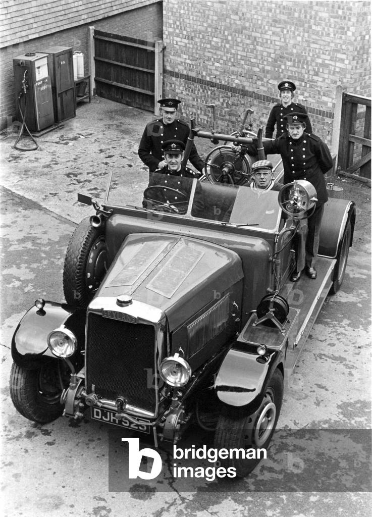 Once a familiar site, now a rarity, the Leyland fire engine with her renovators, c.1970