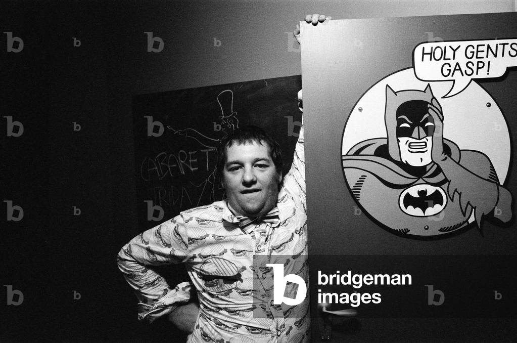 Tommy Roberts, owner of Mr Freedom's boutique and restaurant, pictured outside the Batman gents toilets where customers can draw what they want on a blackboard. The restaurant is in the basement of Mr Freedom clothing boutique, 20 Kensington Church Street, London. 30th July 1971 (b/w photo)