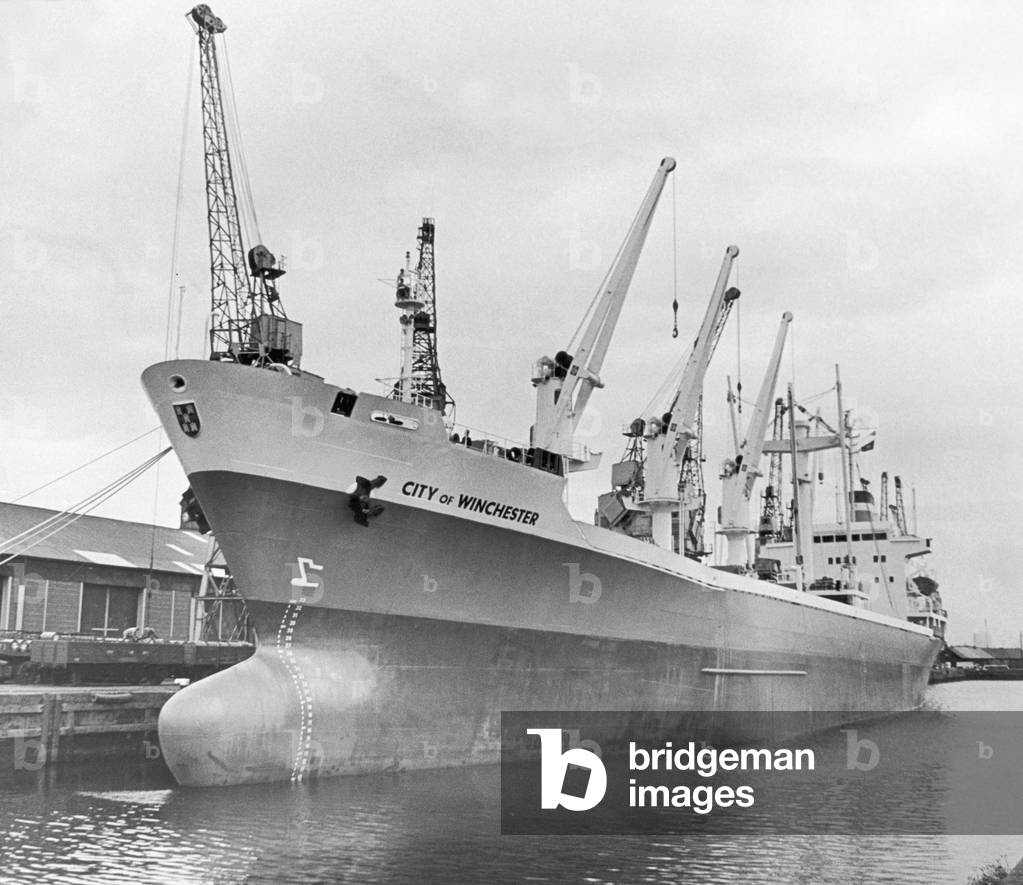 The new Ellerman Line cargo ship The City of Winchester seen here being loaded at Middlesbrough dock with structural steel and general goods for the Arabian Gulf. 21st June 1976 (b/w photo)