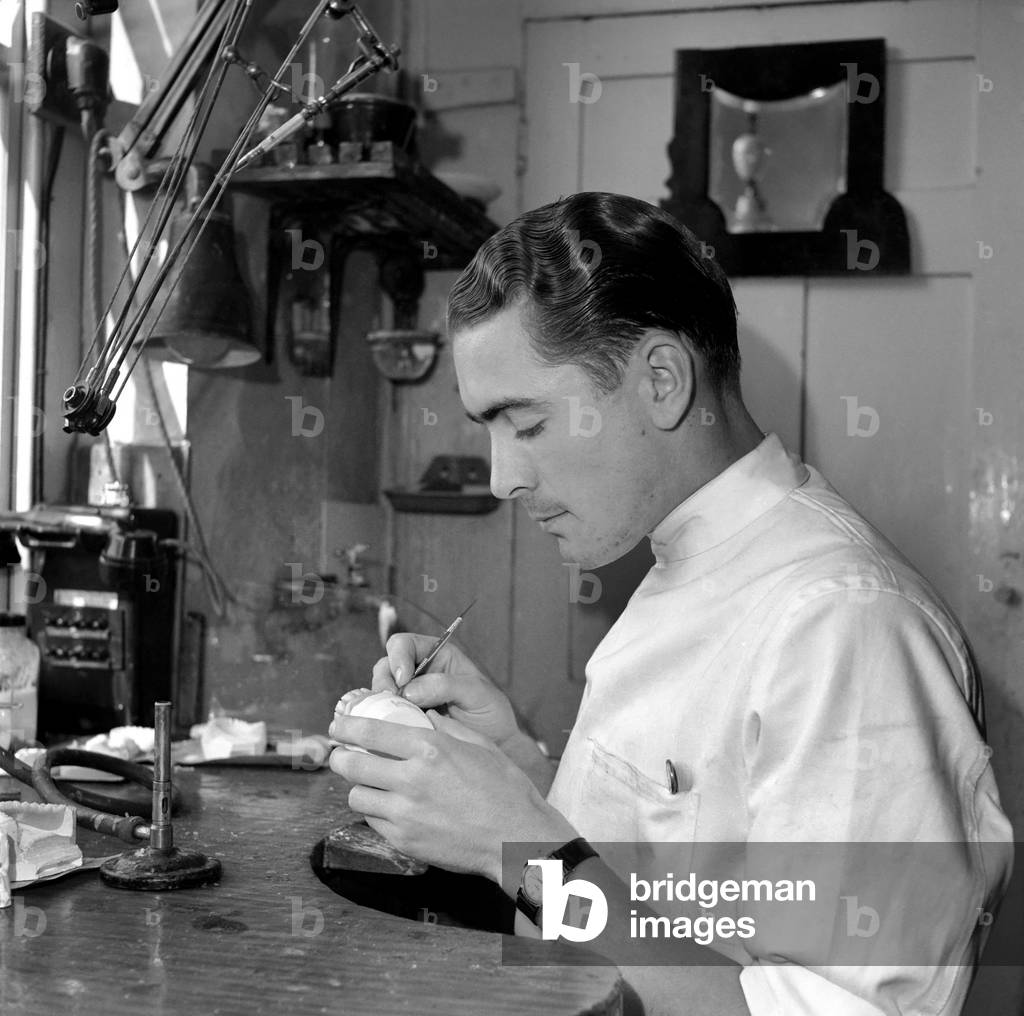 Dental mechanic watch repair. Mr. R. Guy at work in Lab. S.E.I. September 1953