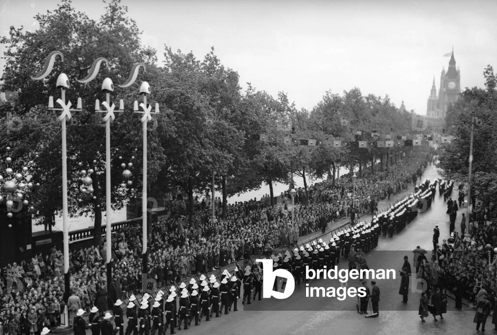 Members of the Royal Marines march down Victoria Embankment accompanying the Queen and the Duke of Edinburgh on their way to Westminster Abbey for her coronation 2nd June 1952 (b/w photo)