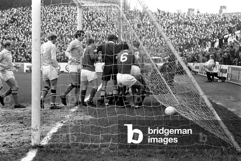 Manchester City 4 v. Manchester United 0. The referee sorts out trouble in United goalmouth with Stepney on the ground. November 1969 (photo)