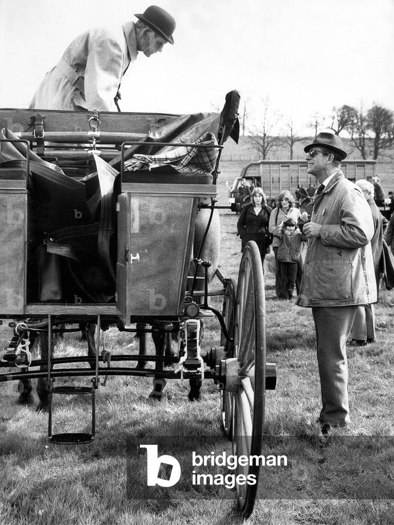 Prince Phillip the Duke of Edinburgh enjoyin his favourite pastime talking to someone about carriage driving, 29/04/1973