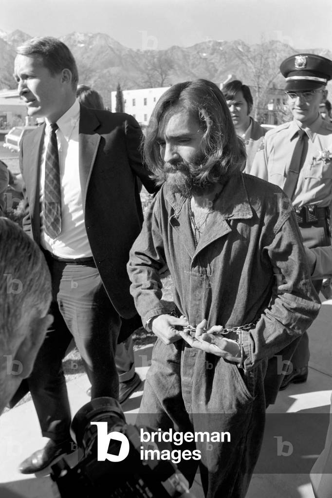 Accused murderer being led to and from court house in Inyo County, California. He is Charles Miller Manson, aged 34 years. 
05/12/ 1969