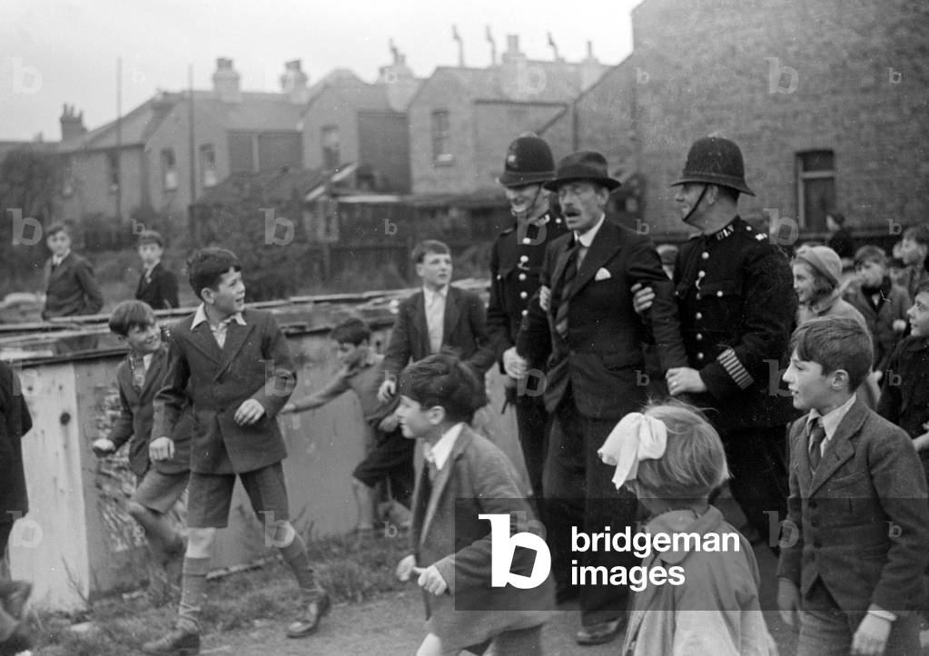 Alfieri. Police make an 'arrest' during Invasion Exercises, Kingston, London.
25th October 1942