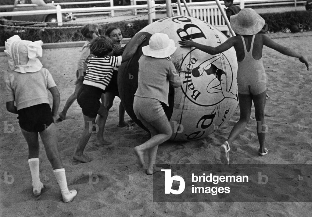 A game of push-ball on the sands at Deauville, Northern France. 
Circa 1960