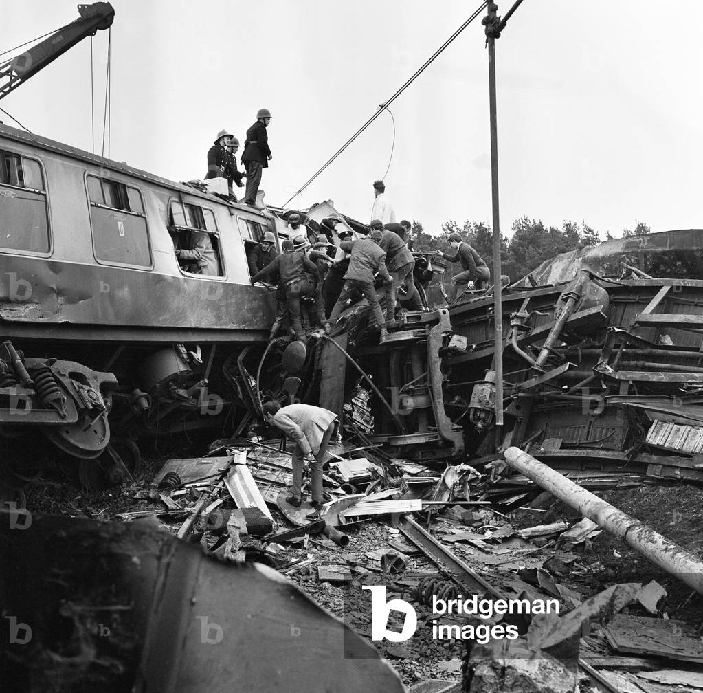 The Hixon rail crash occurred on 6 January 1968 when a low-loader transporter carrying a 150 ton electrical transformer was struck by the 11.30 Intercity Manchester to Euston express train on a recently installed automatic level crossing at Hixon, Staffordshire, England., 1968 (b/w photo)