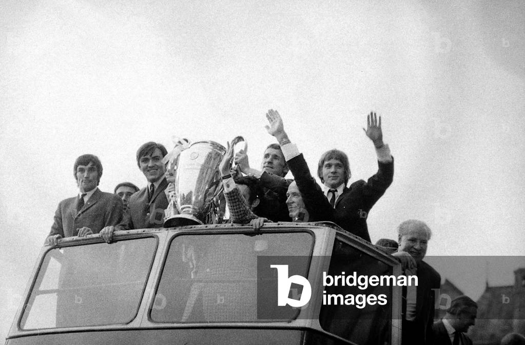 Manchester United Football Team return after winning the European Cup - Matt Busby and the team ride through Manchester on a bus with the cup. June 1968 (photo)