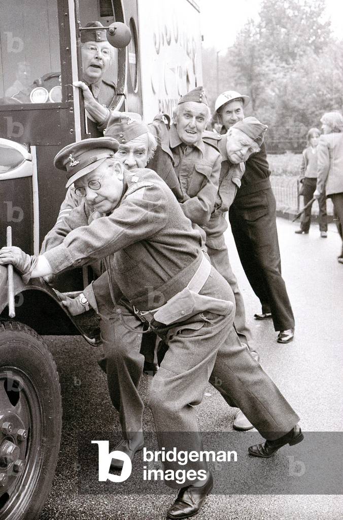 Dads Army cast in costume to open the 'The Real Dads Army' exhibition at the Imperial War Museum in Jones's meat van, October 1974 (b/w photo)