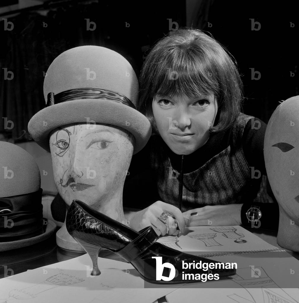 Mary Quant, clothes designer, standing inside her shop Bazaar with examples of the shoes and hats that she designs and sells. Mary's shop is in The Brompton Road, Knightsbridge,London, SW1. Picture taken 14th October 1960