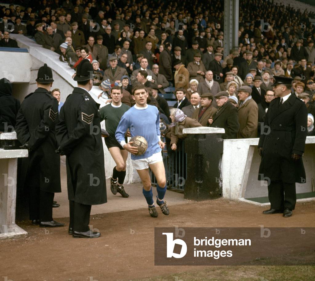 Manchester City footballer John Crosson walks out of the tunnel onto the pitch before his side's league division one match against BurnleyMarch 1969 (photo)