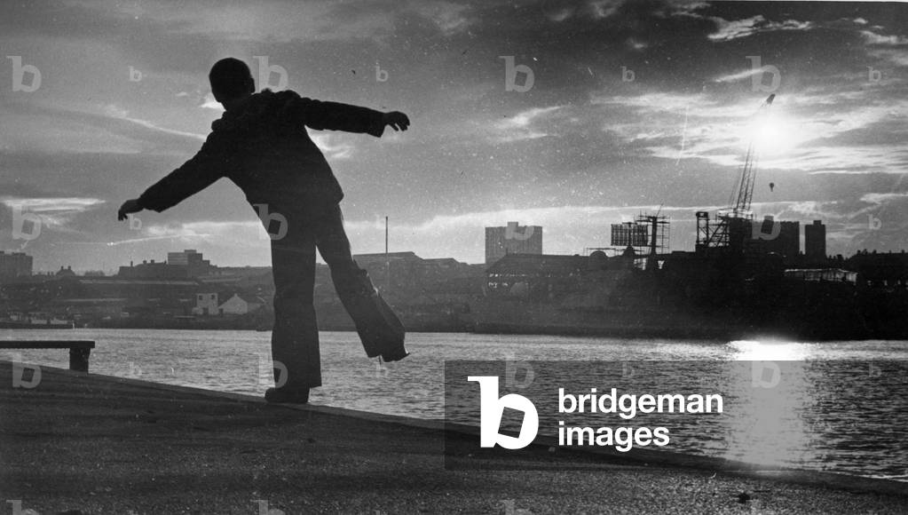 A young boy plays along the banks of the River Tyne, c. 1970