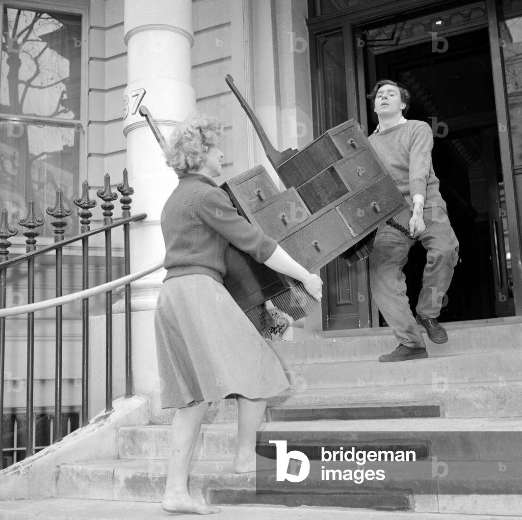 Doreen Bennongton a female furniture remover
Circa 1962