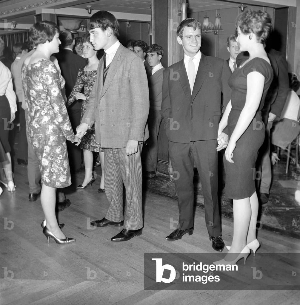 Teenager Fashions: Male Grooming: The teenage boys who go to the Ilford Palais have had to change their style of dress since the introduction of a formal dress code. October 1960 (b/w photo)