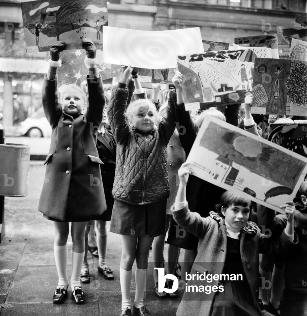 Children from The Glebe Primary School, Sussex Road, invited to illustrate 16 different categories of weather ranging from foggy nights to sunny days. At Thames Television Studio's. One of the youngest boys with his sunny day picture. November 1969