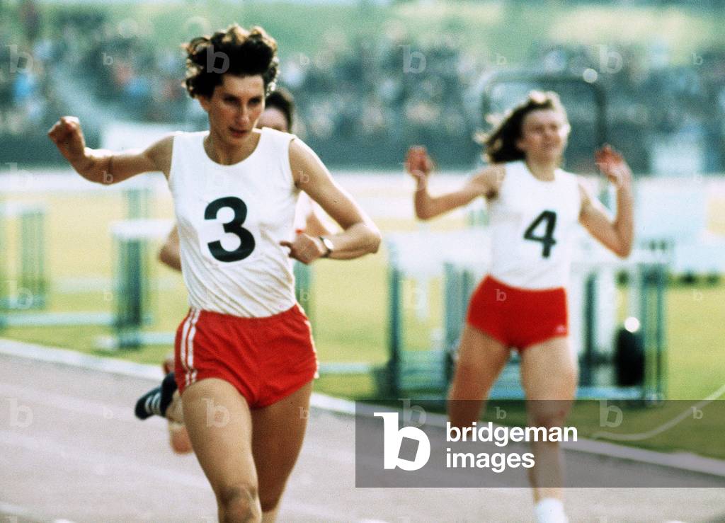 Irena Szewinska competes in the 200 Metres during Athletics Championship Britain v Poland - Irena Szewinska won her first Olympic Gold at 18 as part of the Polish sprint team at the Tokyo Olympics (64) where she also won silver at long jump and 200m - she broke the world record to win Gold at 200m in Mexico (68) - In Montreal (76) she won Gold at 400m at the age of 30 - She is the first woman to break 50 seconds for 400m, June 1972 (photo)