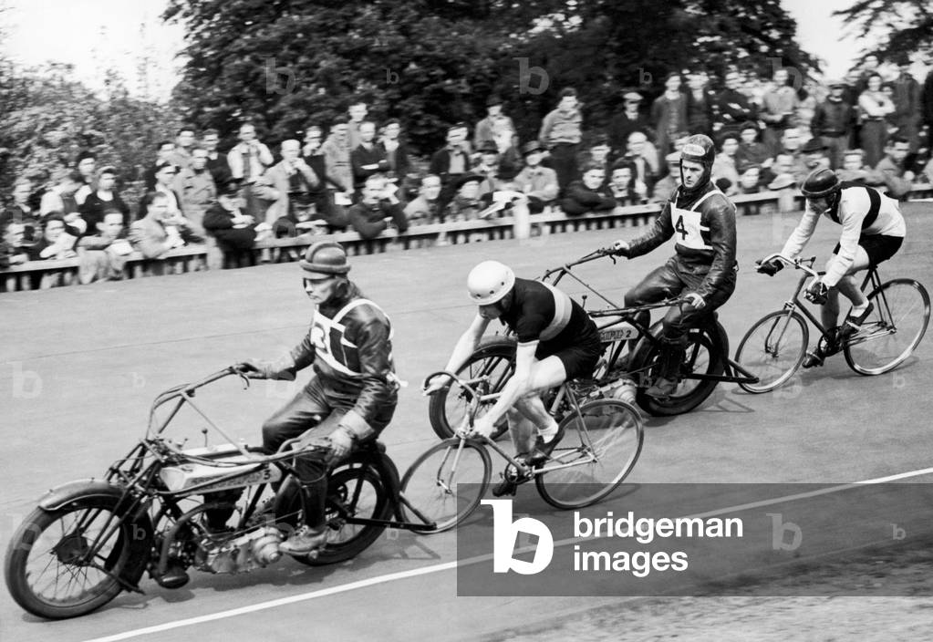 Competitors in a keirin race at Herne Hill velodrome. Polytechnic Cycling Club members on their victory lap. 18th May 1946 (b/w photo)