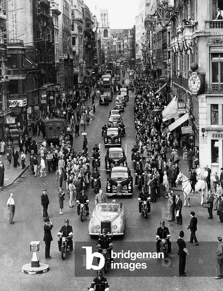President Dwight D Eisenhower August 1959 passes crowds of well wishers in Ludgate Circus in London on his way to St Pauls cathedral
