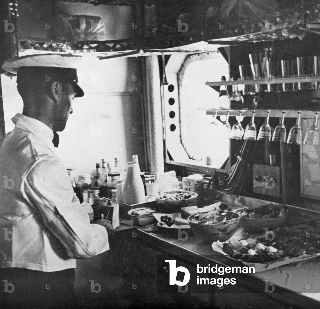 Preparing Lunch in the Imperial Airways liner 'Scylla'. The airline was merged into British Overseas Imperial Airways corporation in 1940. 18th September 1936.
