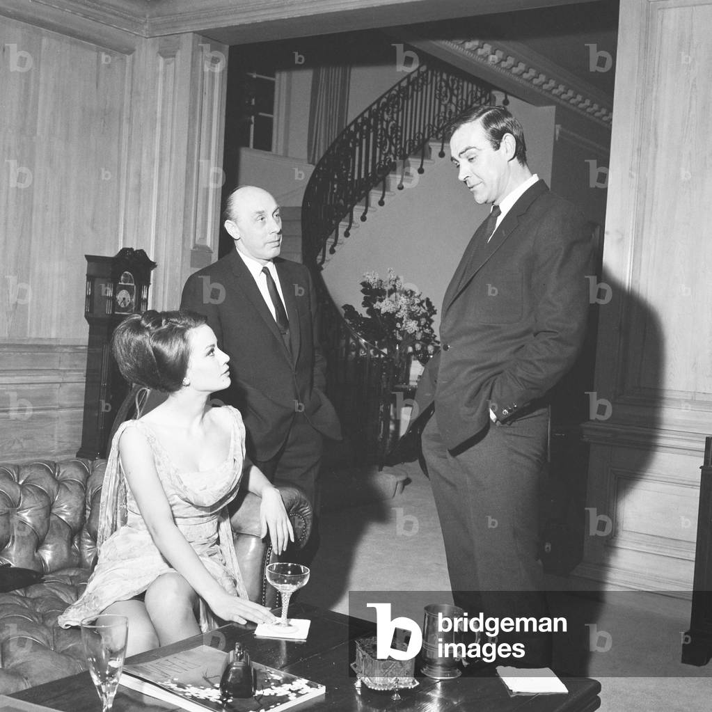 Parisienne actress Claudine Auger who will play Domino in the James Bond film Thunderball, seen here with Sean Connery during an interview with the Daily Mirror show business reporter Donald Zec. 17th February 1965 (b/w photo)