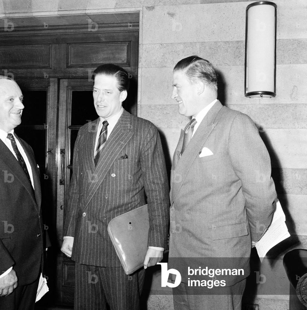 George Henry Hubert Lascelles discusses arrangements for jazz section of Leeds Music Festival 1958 with his brother Gerald Lascelles and John Addleston 1958 (b/w photo)