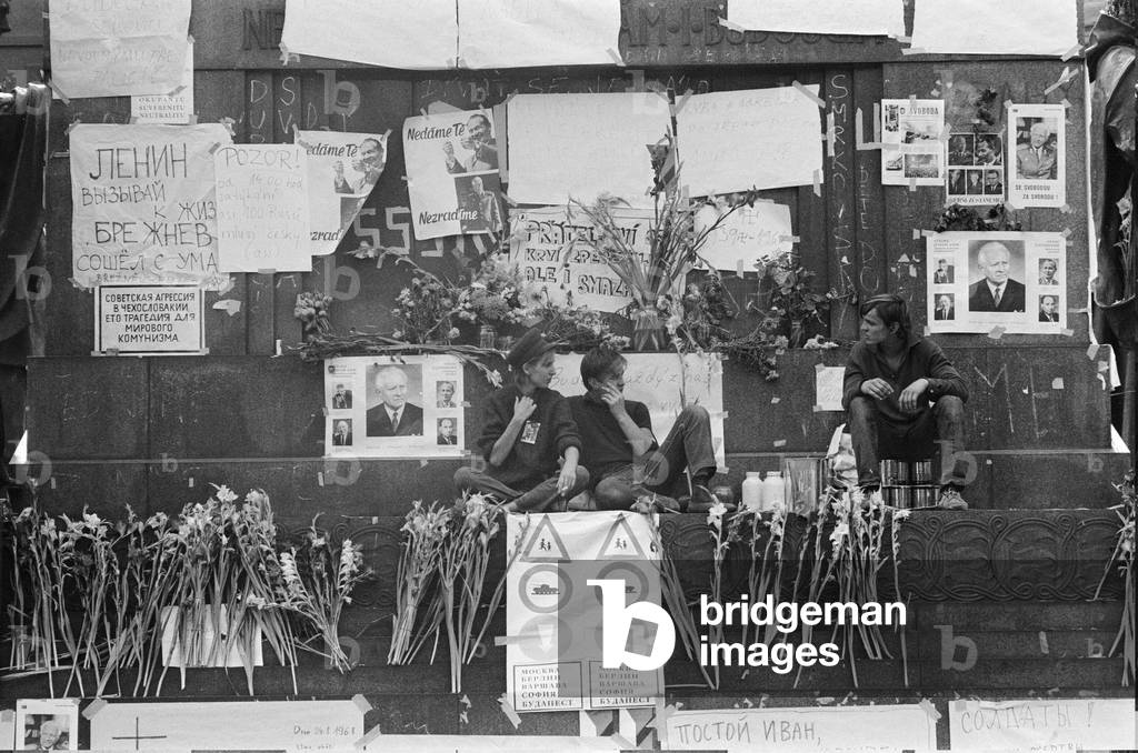 Prague, Czechoslovakia. The Prague Spring, a period of political liberalization in Czechoslovakia during the era of its domination by the Soviet Union after World War II. Young people clear posters from King Wenseslas statue. August 1968 (b/w photo)