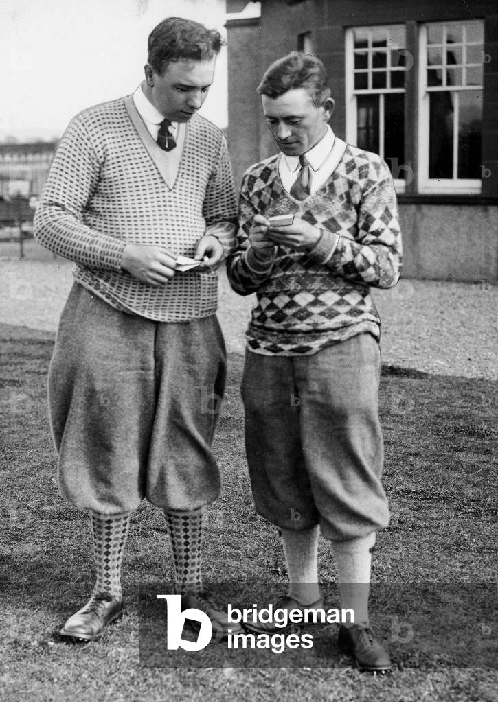 R Turner golfer Williamwood With D McCulloch Troon adding up scrore card Plus fours, August 1924 (b/w photo)