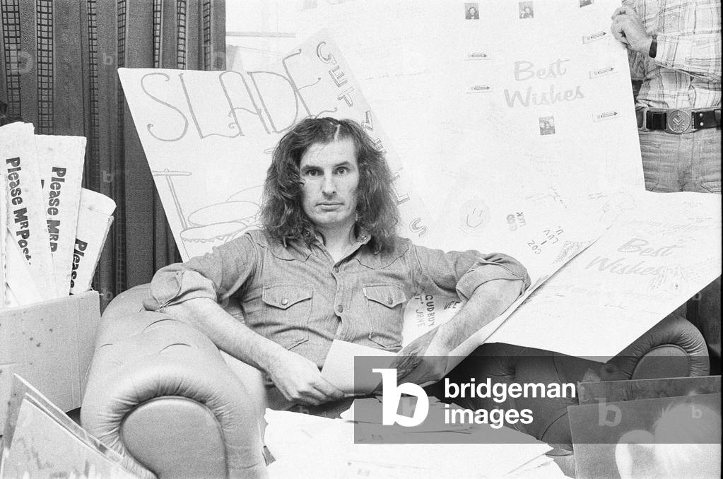 Don Powell, drummer with Slade, reading get well cards at his parents home in Bilston, Staffs. 31st July 1973 (b/w photo)