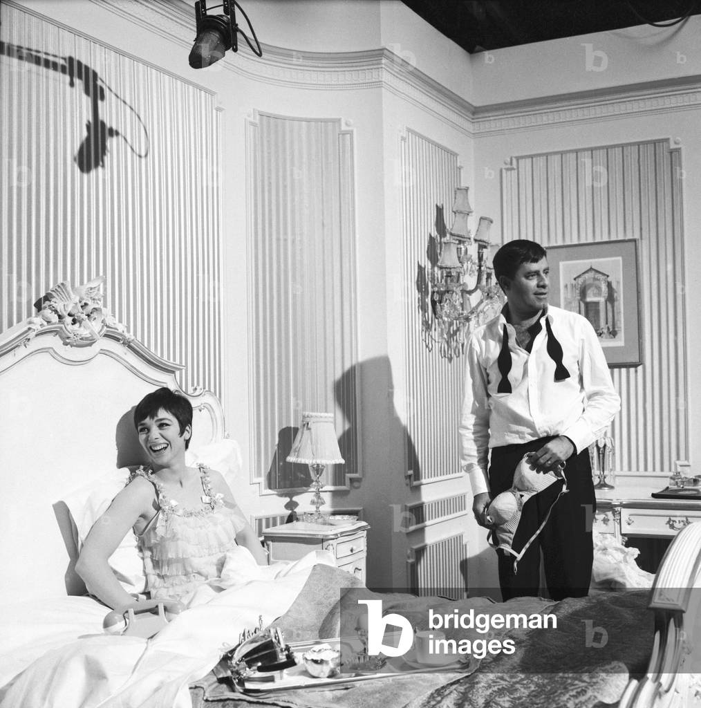 American actor and comedian Jerry Lewis seen here with actress Jacqueline Pearce during a break in filming 