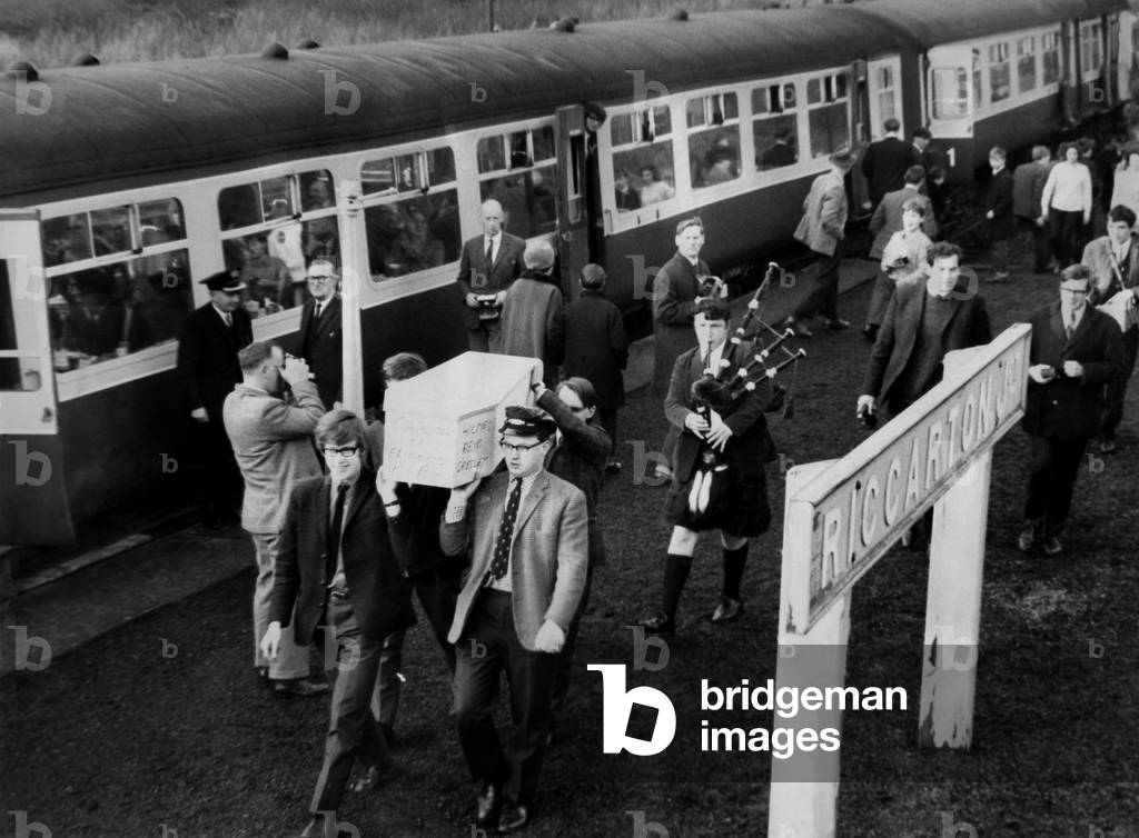 Mr. John Arnott-Brown, secretary of the North of England Steam Traction Society and some of the members carried a white coffin to be buried at Riccarton Junction, on 6th January 1969, to mark the closure of the picturesque Waverly route from Carlisle to Edinburgh, 6th January 1969 (b/w photo)