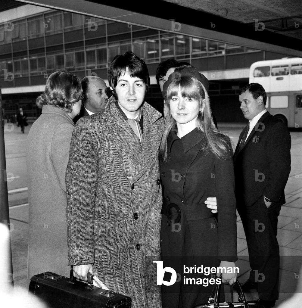 The Beatles leaving Heathrow Airport for India where they will meet Maharishi Mahesh Yogi on a meditation trip. Paul McCartney and his girlfriend Jane Asher February 1968 (b/w photo)