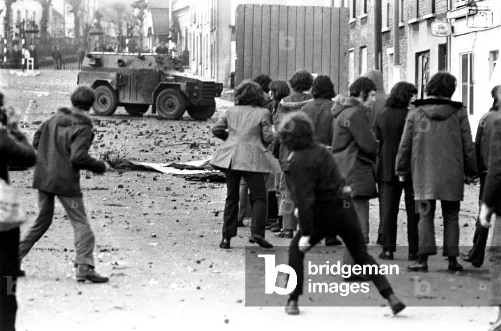 Demonstrators pelt the army with stones following a civil disobediance March through Belfast. February 1972 72-1641-005