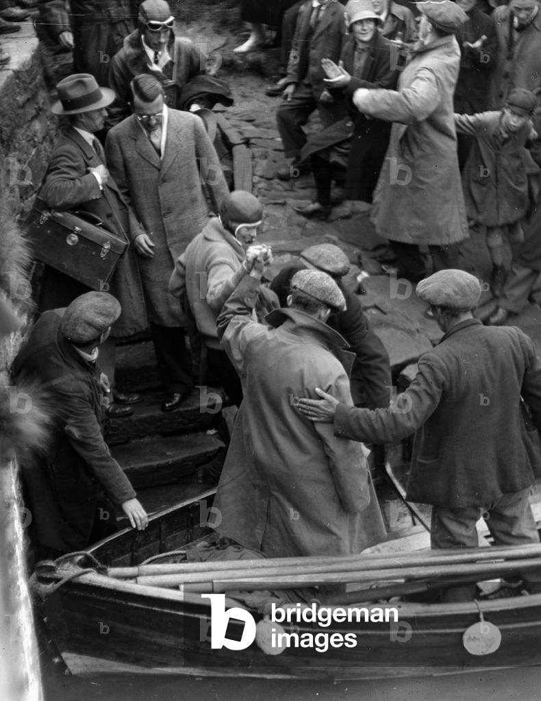 Amelia Earhart flies the Atlantic. OPS Her coming ashore at Burry Port, South Wales, where she landed after flying 1,900 miles from Newfoundland, 18th June 1928