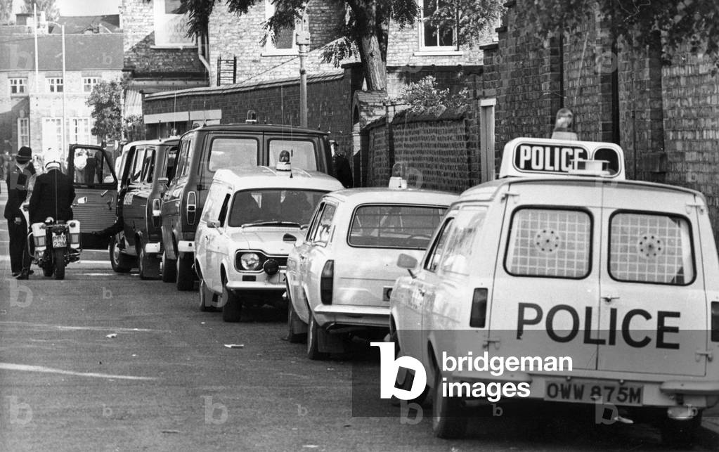 A line of police cars and vans in a Newcastle Street, c.1970