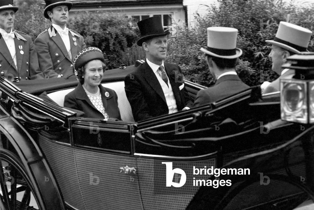 Her Majesty Queen Elizabeth II arriving for a ceremony in horse drawn carriage with her husband Prince Philip, Duke of Edinburgh, June 1977 (b/w photo)