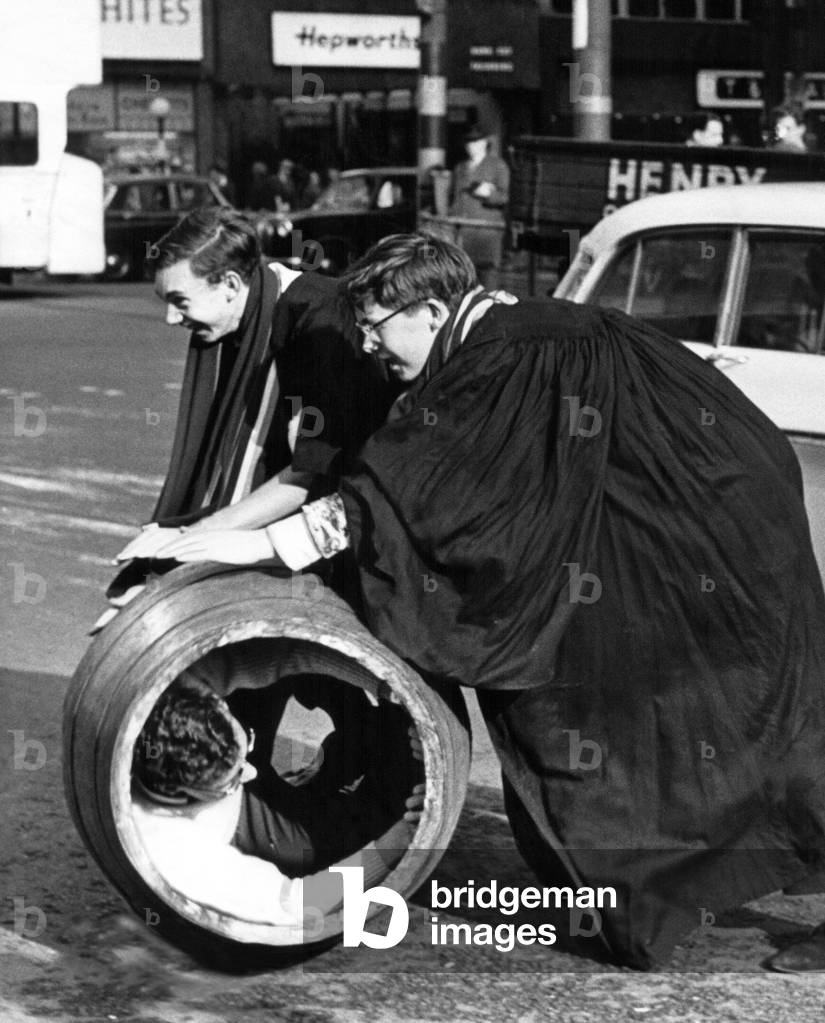 Newcastle students rolling out the barrel around Grey's Monument on 22th October 1963