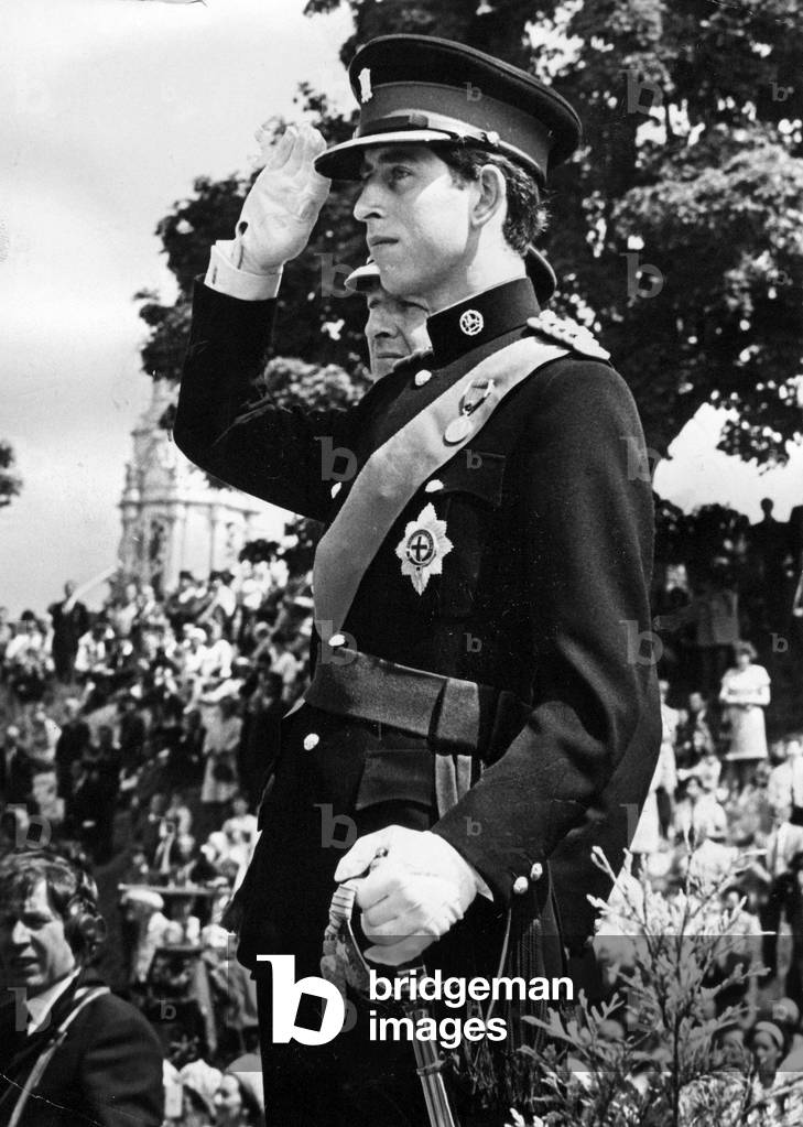 Prince Charles, The Prince of Wales taking the salute at the parade - The Prince appeared in his investiture uniform for the first ime today when he presented the colours at the inauguration of the Royal REgiment of Wales at the freedom of the city on behalf of the regiment 11 June 1969 (b/w photo)