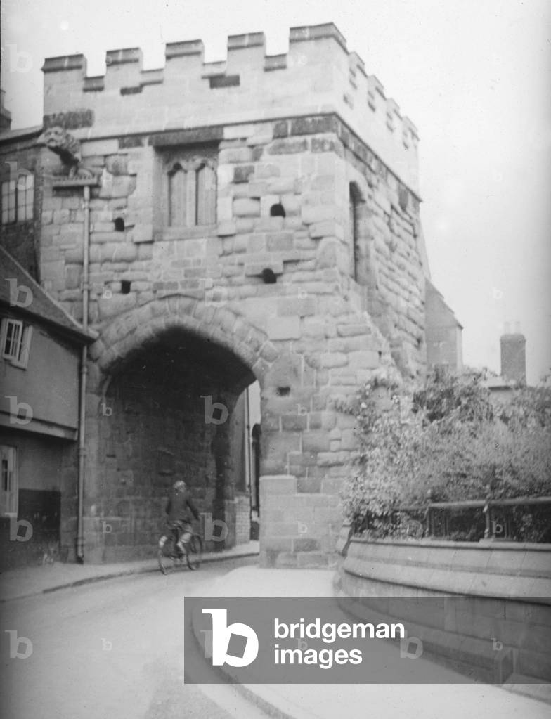 The Cook Street Gate Coventry City Centre built around 1385, and presented to the city by Col. W. F. Wyley in 1913. The battlements were added in 1931-32 during a period of restoration to the gate. Circa January 1936 (b/w photo)