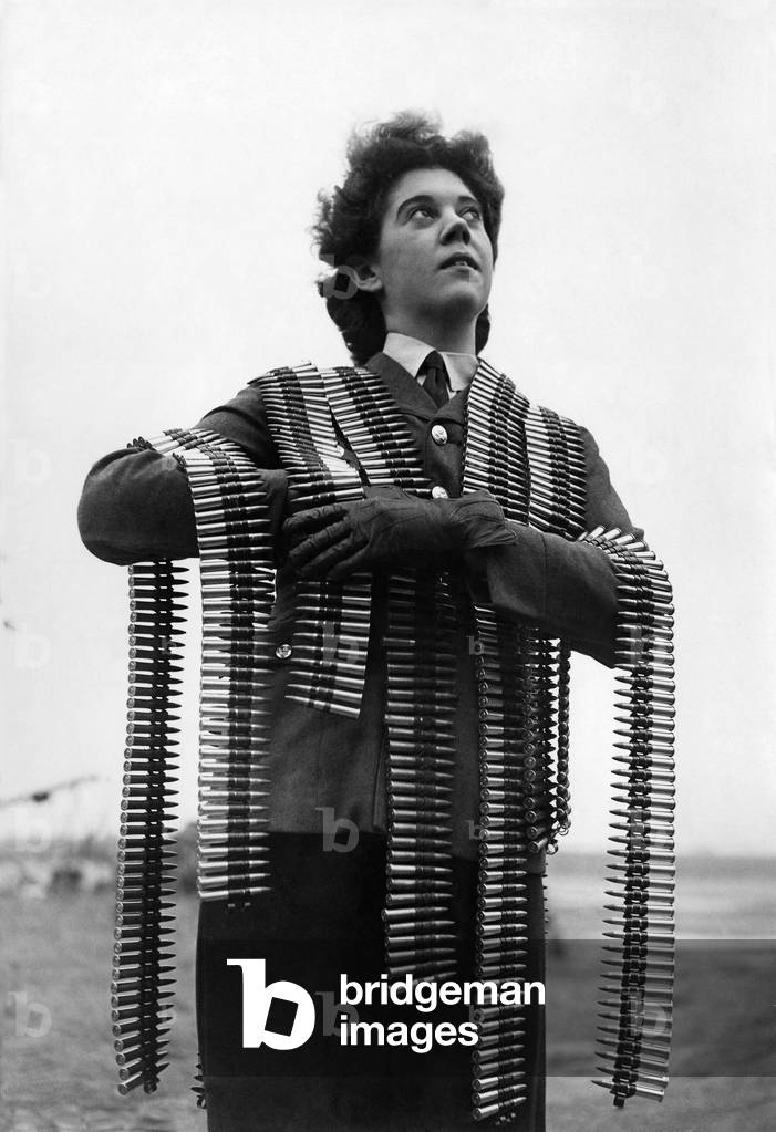 World War II Women: Annie get your gun. A WAAF armourer loaded down with ammunition prior to being put on board a Bomber. September 1942