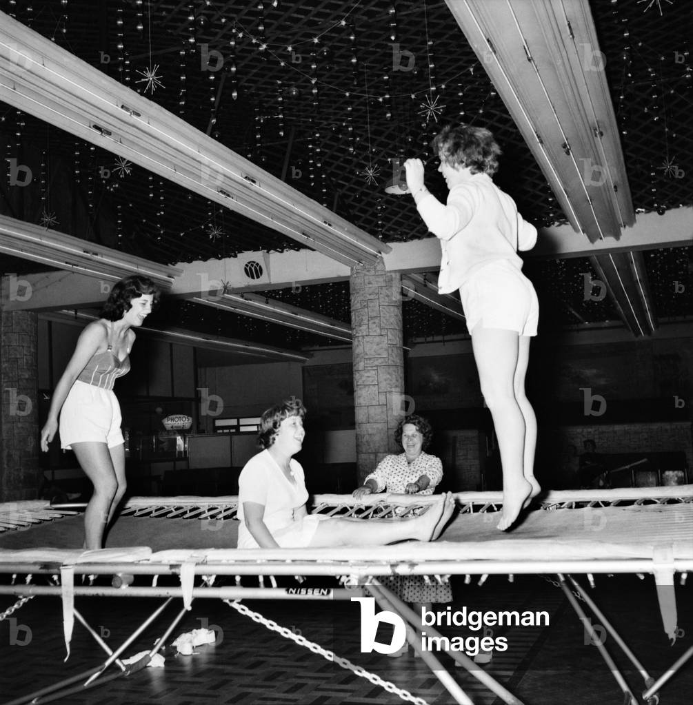 Bultins Holiday Pwllheli: Mrs. Nellie McGrail, Pools Winner. Horse riding/Boating/Elephant/Roller skating/Family. Now a ride the big wheel for Mrs. McGrail and Barbara. Trampolining. June 1960