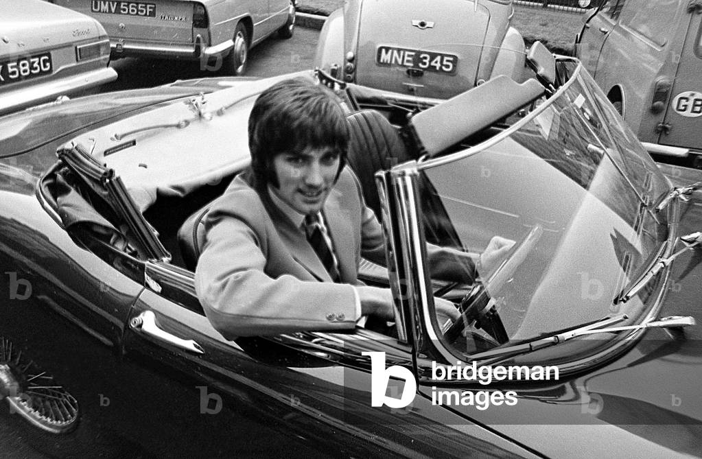 George Best Football Player in sports car c. 1965 (photo)