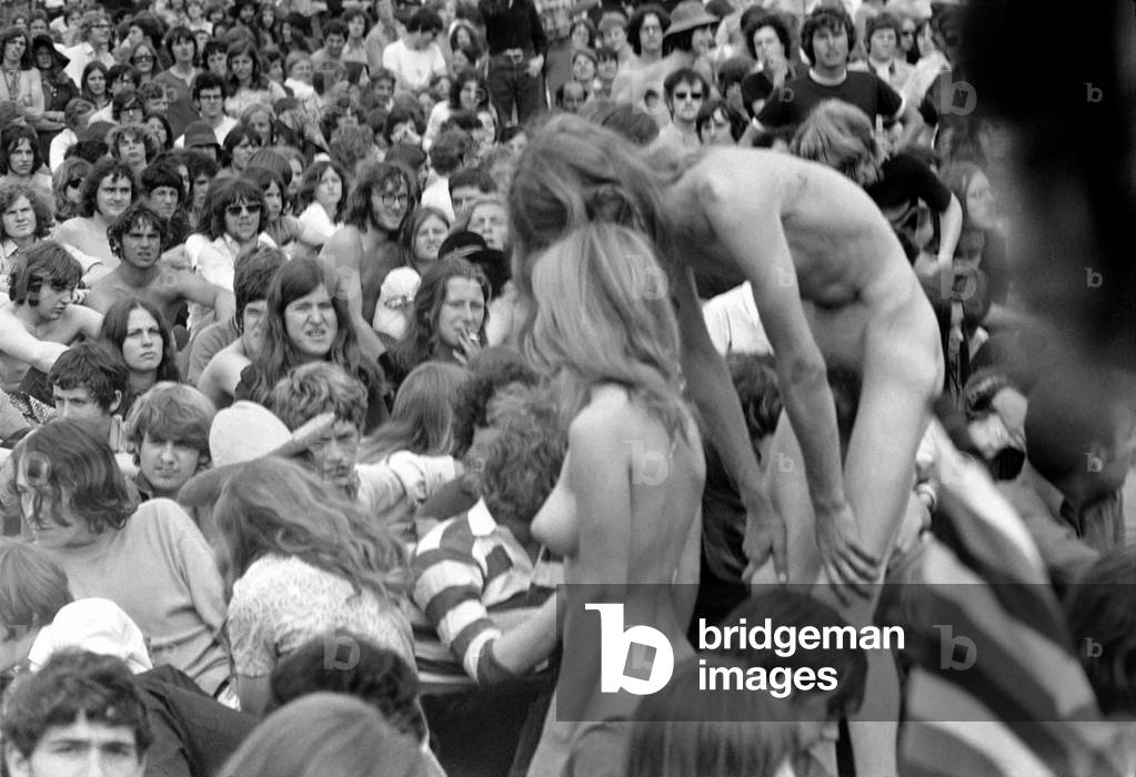Hippies: Nudism: Nudes in Hyde Park. The girl and her boyfriend who stripped naked and then made love in public during the concert. July 1970