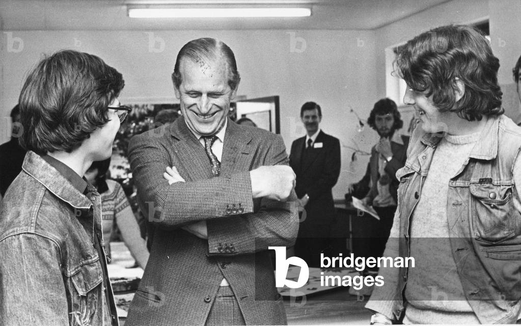 Prince Philip, Duke of Edinburgh, shares a joke with youngsters to the Eskdale Outward Bound School, 27/04/1979