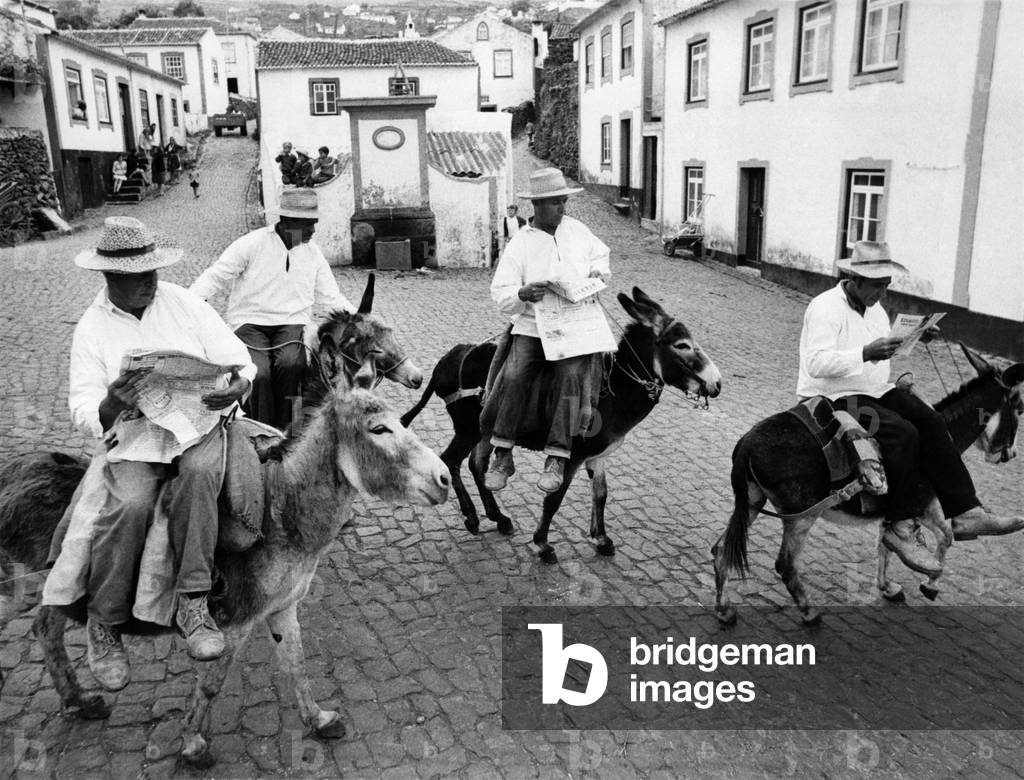 Transportation problem solved in the Azores, men travelling around on donkeys.