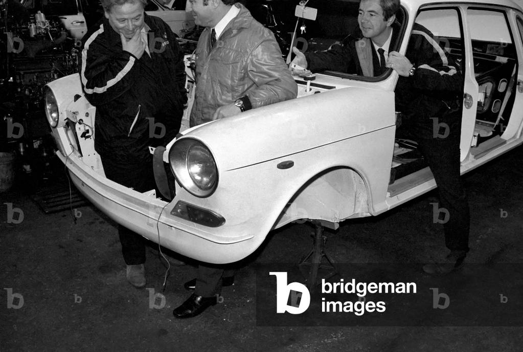 Humour: Transport: Motor cars: Three men looking over the engine of their car. November 1969