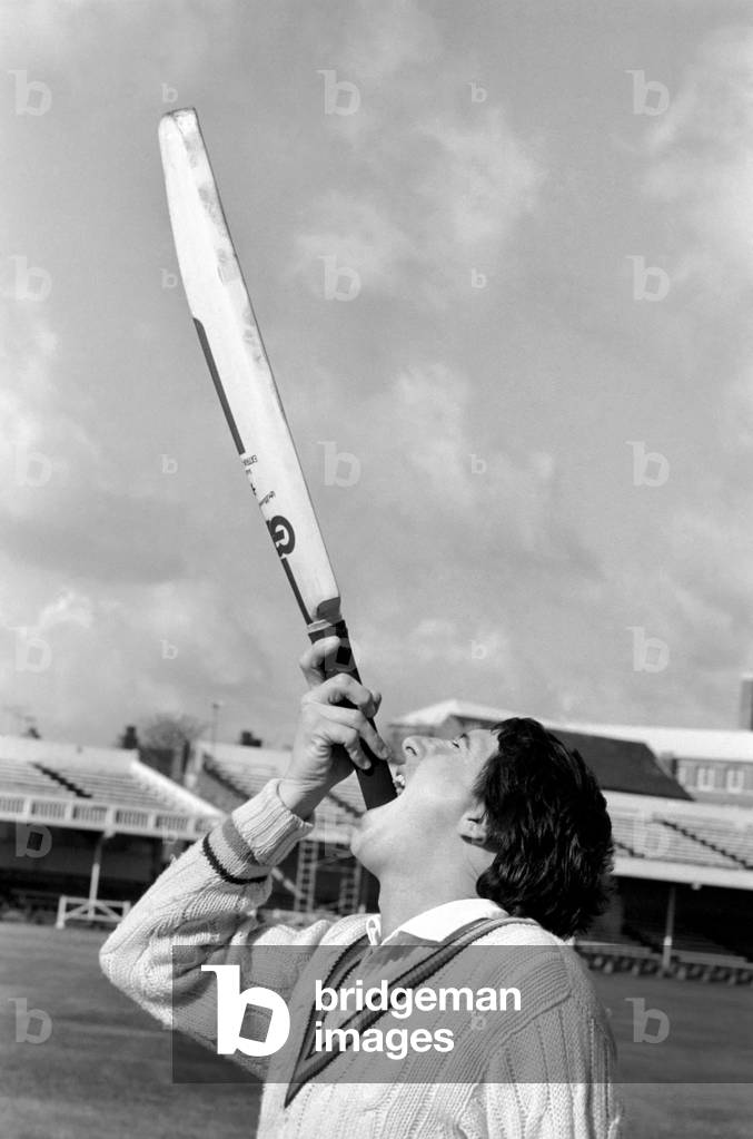 Cricketer Derek Randall and his repertoire of tricks photographed at Trent Bridge as he prepares for the new season. Balancing and juggling the cricket bat, April 1977 (b/w photo)