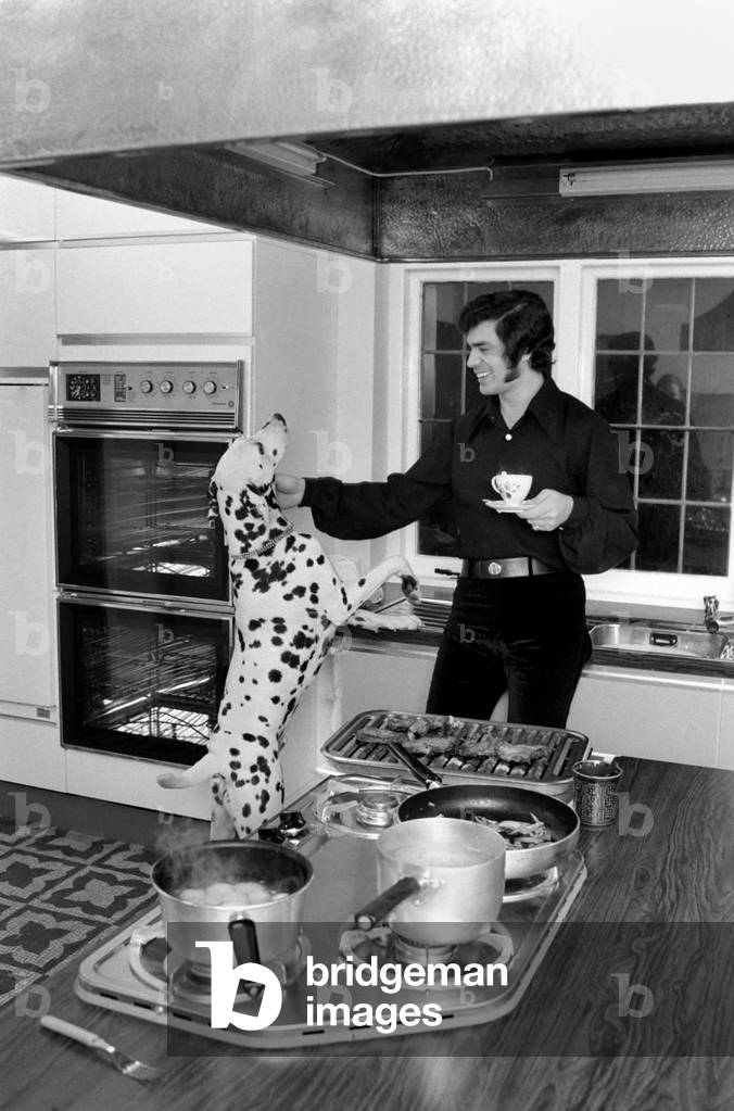 Engelbert Humperdinck's new home in St. Gerorge's Hill, Weybridge 
Engelbert with his dalmatian dog in the kitchen. 
December 1969
